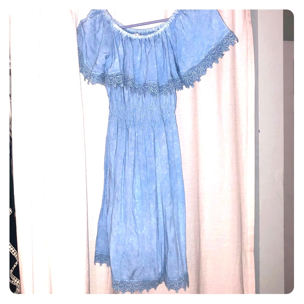 Off the shoulder blue dress.